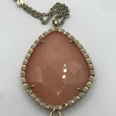 Rose Quartz Pendant and Silver Tone Necklace With a Tassel