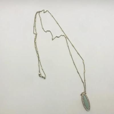 Necklace With A Silver Tone Chain And Light Blue-Green Pendant Surrounded By Small Clear Stone 28”