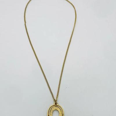 Gold Tone Necklace With An Oval Pendant 16”
