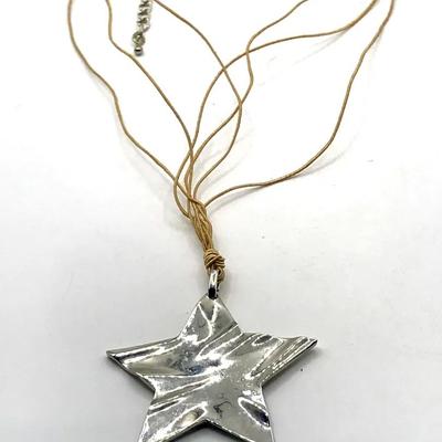 Silver Tone Star Pendant Necklace On A Brown Cord