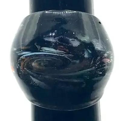 A Plastic Ring With a Swirl Design Size 7.5