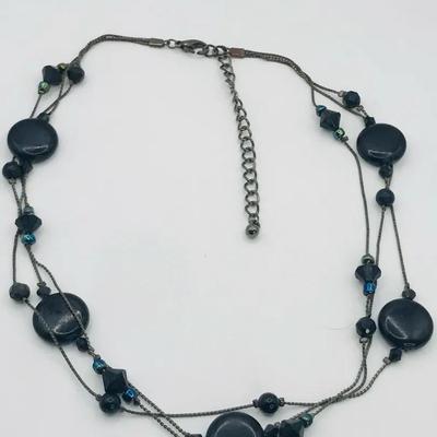 Multi Strand Black Beaded Necklace With A Gunmetal Tone Chain