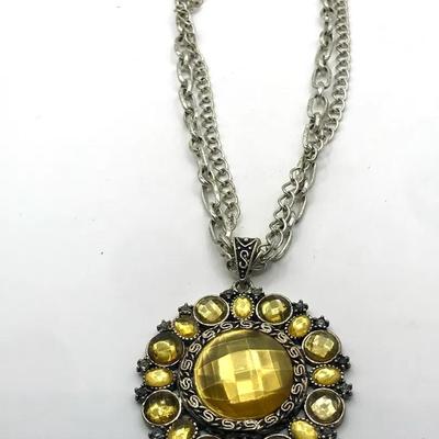 Silver Tone Necklace Large, Round Pendant Featuring Yellow And Dark Gray Stones