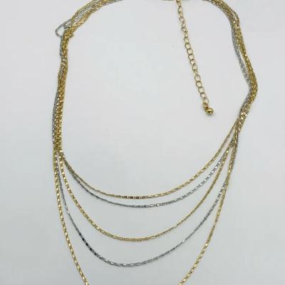 Multi Strand Layered Necklace Featuring Both Gold And Silver Tone Chains 16”