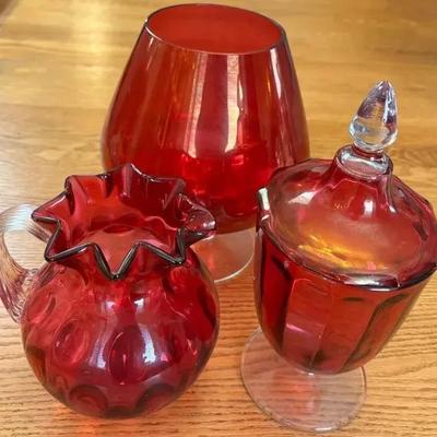 3 Pieces of Cranberry Glassware , Lidded Jar , Fenton Pitcher Vase and Large Round Vase 