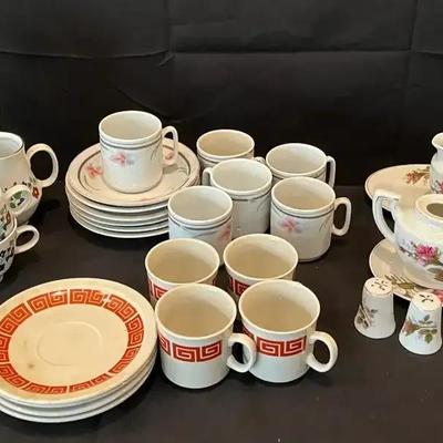 Decorative China Collection with Teacups, Plates, and Serving Pieces
