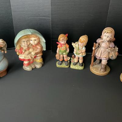 Large Porcelain Figurines Resembling Hummel Figurines 