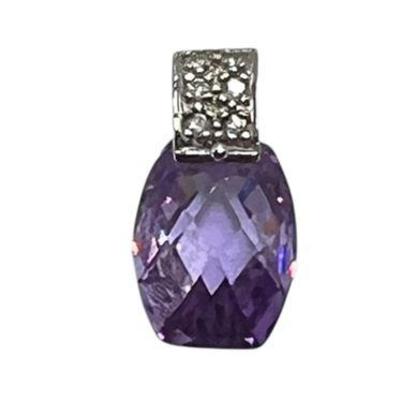 Lot 153  
Sterling Silver 3.1 Gram Purple Topaz Gemstone Pendant .5"