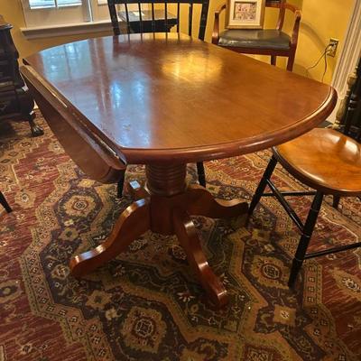 Sale Photo Thumbnail #70: Vintage drop leaf table. Measures 42 inches round. $175. 