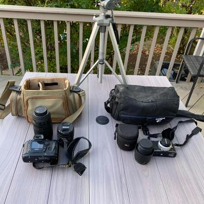 Nikon and Olympus camera w tripod.
not sure if they work