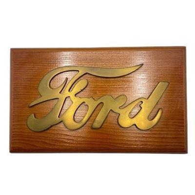 Lot 135 
Brass Script "Ford" Logo on Metal Plaque