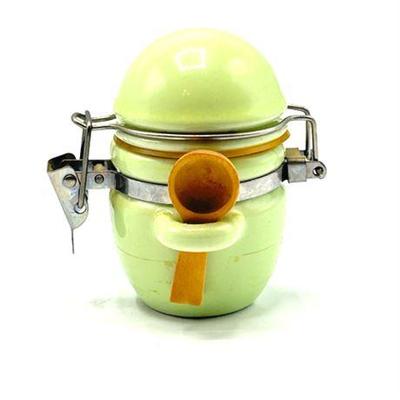 Lot 567   
Vintage Porcelain Small Canister With Clamp and Small Wooden Scooper