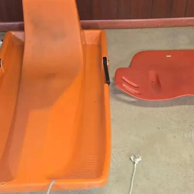 Two Plastic Sleds