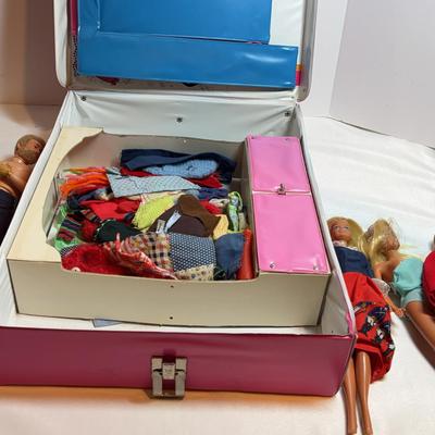 Barbie And Other Dolls In A Case
