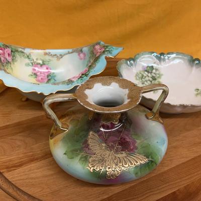 Collection of hand-painted porcelain decorative bowls and vase