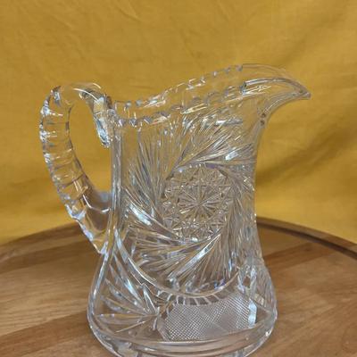 American Brilliant Period cut glass pitcher with starburst and fan motifs