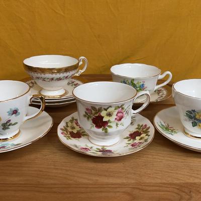 Collection of five English bone china teacups and saucers with floral designs