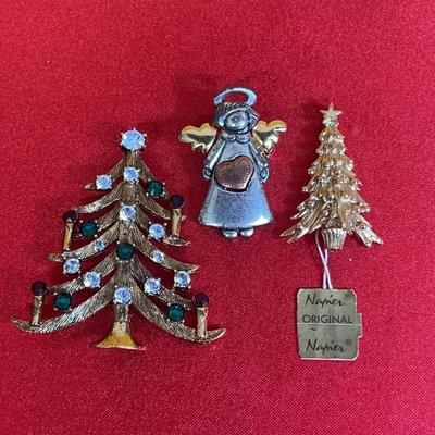 Three vintage Christmas-themed brooches