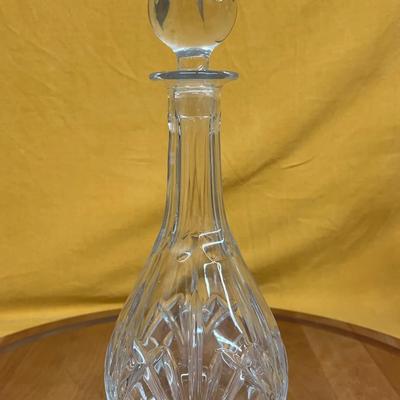 Vintage Waterford Crystal decanter with intricate cut glass patterns and a spherical stopper
