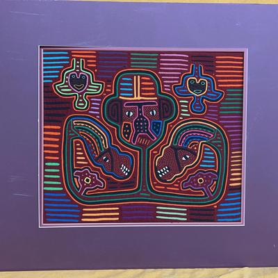 Guna Mola textile art featuring anthropomorphic and animal figures