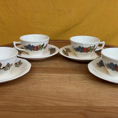 Set of four Atlas Globe China teacups and saucers with floral decoration