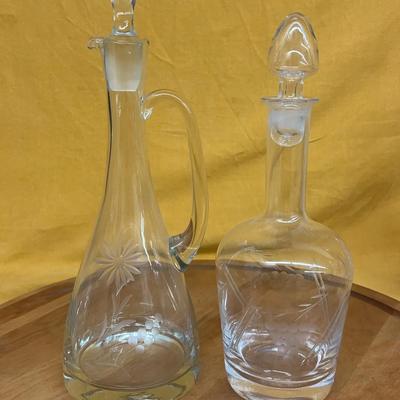 Vintage etched glass decanters with floral designs and stoppers