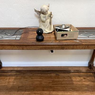 Sale Photo Thumbnail #110: This is a rustic wood console table with leaded glass inlays and carved legs.
