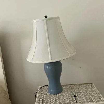 Blue table lamp with off-white shade