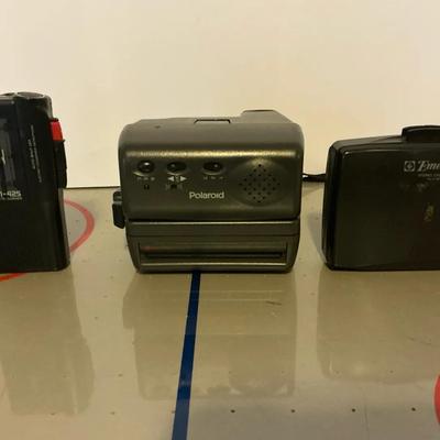 Vintage Electronics Collector's Lot: Polaroid Camera, Sony Microcassette Recorder, and Emerson Casse