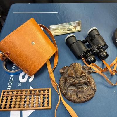Adventurer’s Lot: Tasco 7 x 35 mm Binoculars, Lion Mask Wall Plaque, Japanese Wooden Abacus