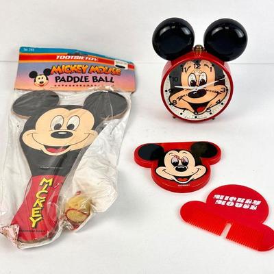 Sale Photo Thumbnail #91: Lot #91 Vintage Mickey Mouse Lot – West Germany Alarm Clock, Sealed Tootsietoy Paddle Ball, Mirror & Comb – Disney Collectibles