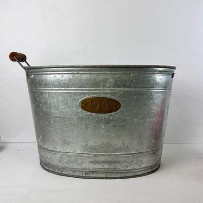 Sale Photo Thumbnail #124: Lot #124 Large Vintage Galvanized Water Bucket – Wood Grip Handle – Brass Plate “2000” (Missing 1 Handle)