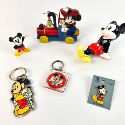 Sale Photo Thumbnail #101: Lot #101 Disney Mickey Mouse Mixed Lot – Vintage Figurines, Key Rings, Enamel Pin & Wooden Ornament
