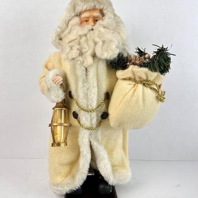 Sale Photo Thumbnail #137: Lot #137 16” Father Christmas in Ivory Coat – Lantern & Sack Figurine on Wood Base