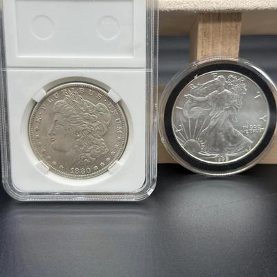 046) 1880 Morgan Silver Dollar + 1999 American Silver Eagle – 2-Coin Silver Lot