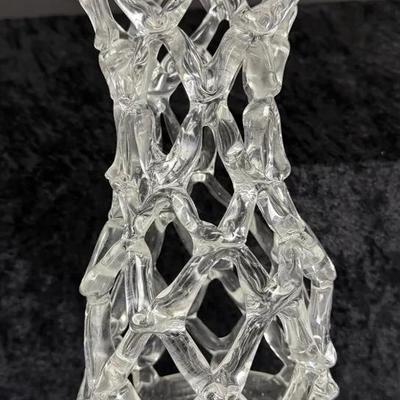 clear, hand-blown art glass vase with a lattice or web pattern