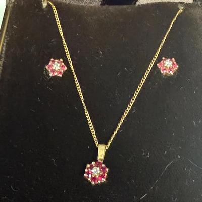 14K yellow gold ruby and diamond flower pendant necklace and matching earrings