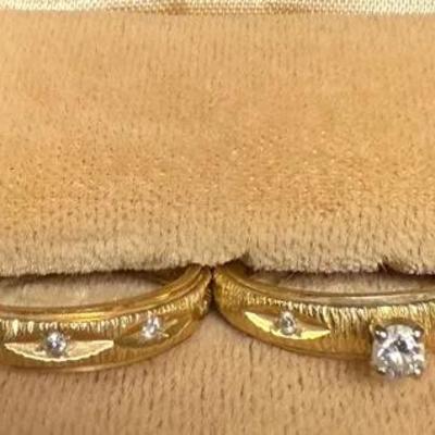 14k pair of yellow gold wedding rings with diamond accents