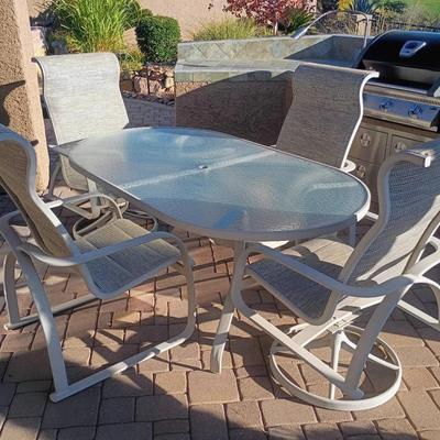 Beige Patio Table And Four Chairs