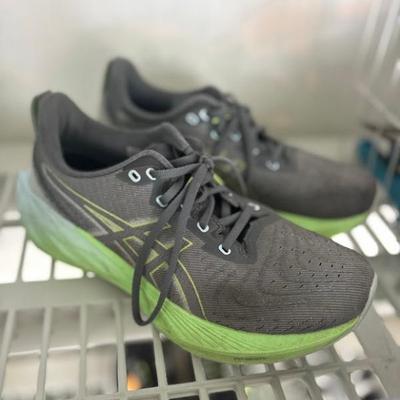 ASICS Novablast 4 running shoes in a Cool Gray/Green Expanse colorway