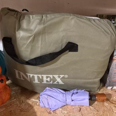 Intex air mattress, likely the Dura-Beam or Comfort model, stored in its carry bag
