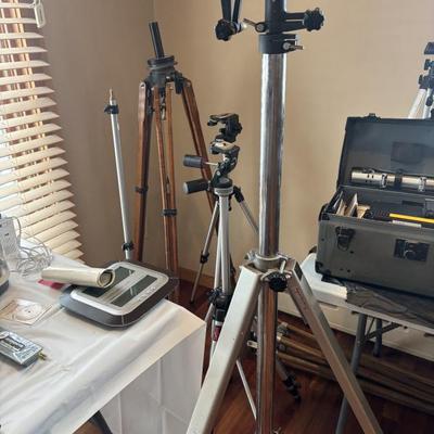Many tripod for cameras and surveying equipment