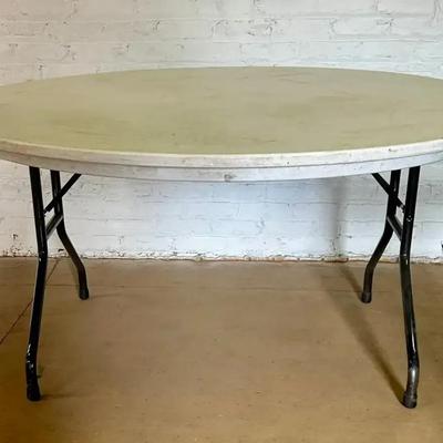 A Folding 5’ Diameter Folding Table