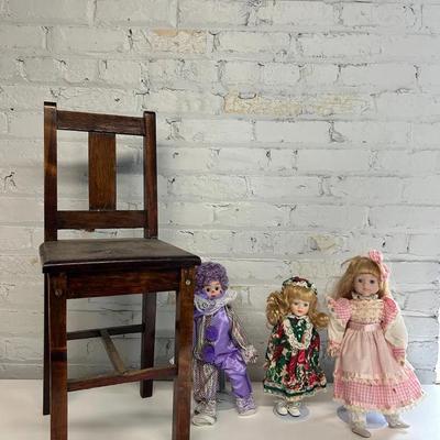 Three Contemporary Porcelain Face Dolls With Stands And A Wooden Child’s Chair 