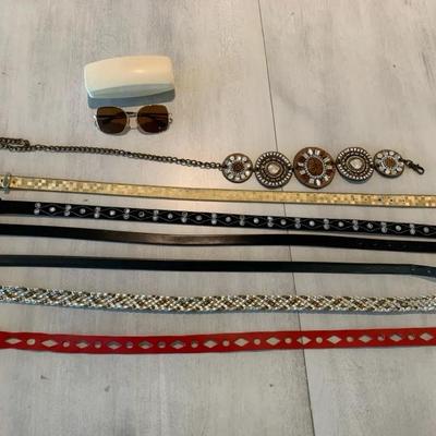 Decorated Woman’s Belts And Sunglasses