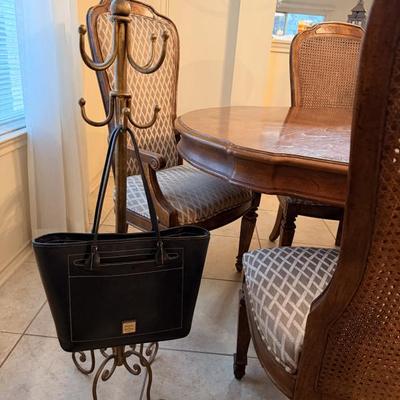 Purse is just modeling — the stand is what’s for sale.