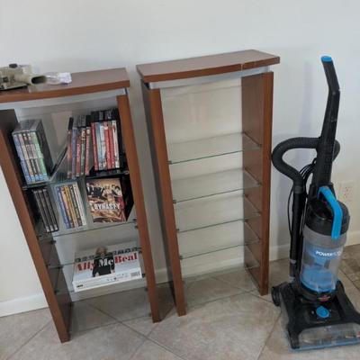 Two bookshelves, laminate w/glass shelves. Tank vaccumm 