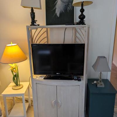 TV stand with matching side table. Hand painted Egret picture, 24" TV, misc lamps, green/blue end table with doors