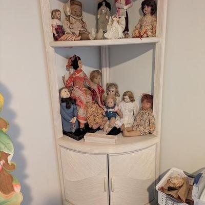 Open faced display cabinet w/storage. Additional doll collection.