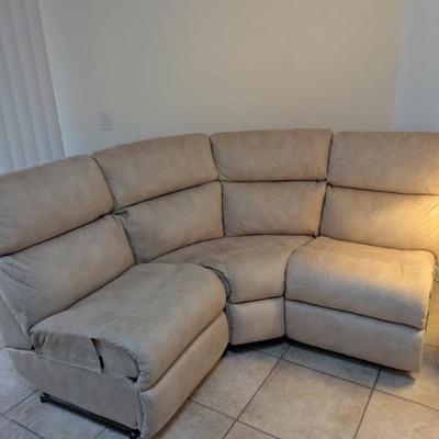 Three-piece sectional sofa. (Indian River Furniture). Upholstered so it can be used as three separate pieces. Leatherette material, In...